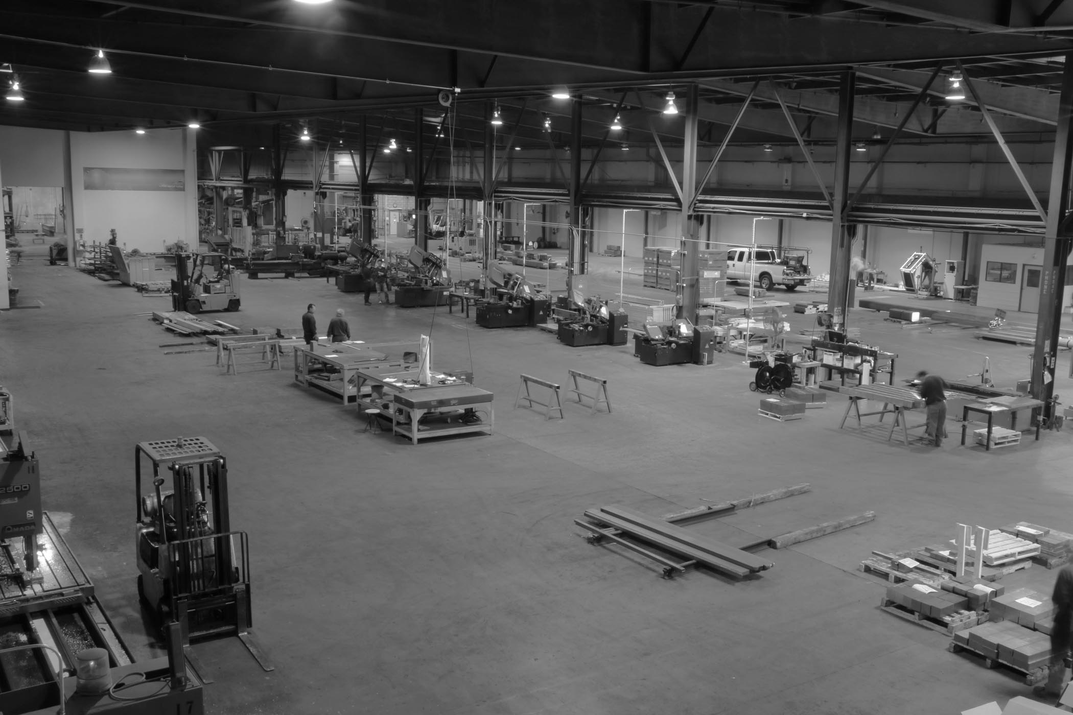 Grayscale photo of a factory plant floor